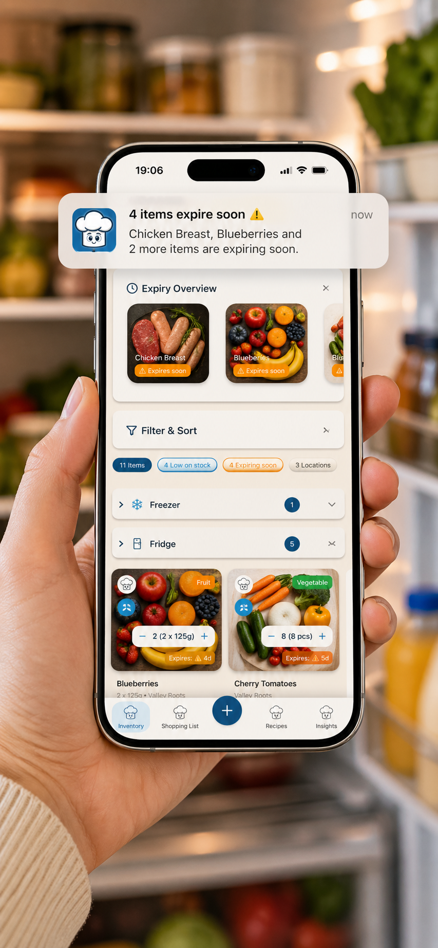 Chefito expiry alert shown on a phone in front of an open fridge.